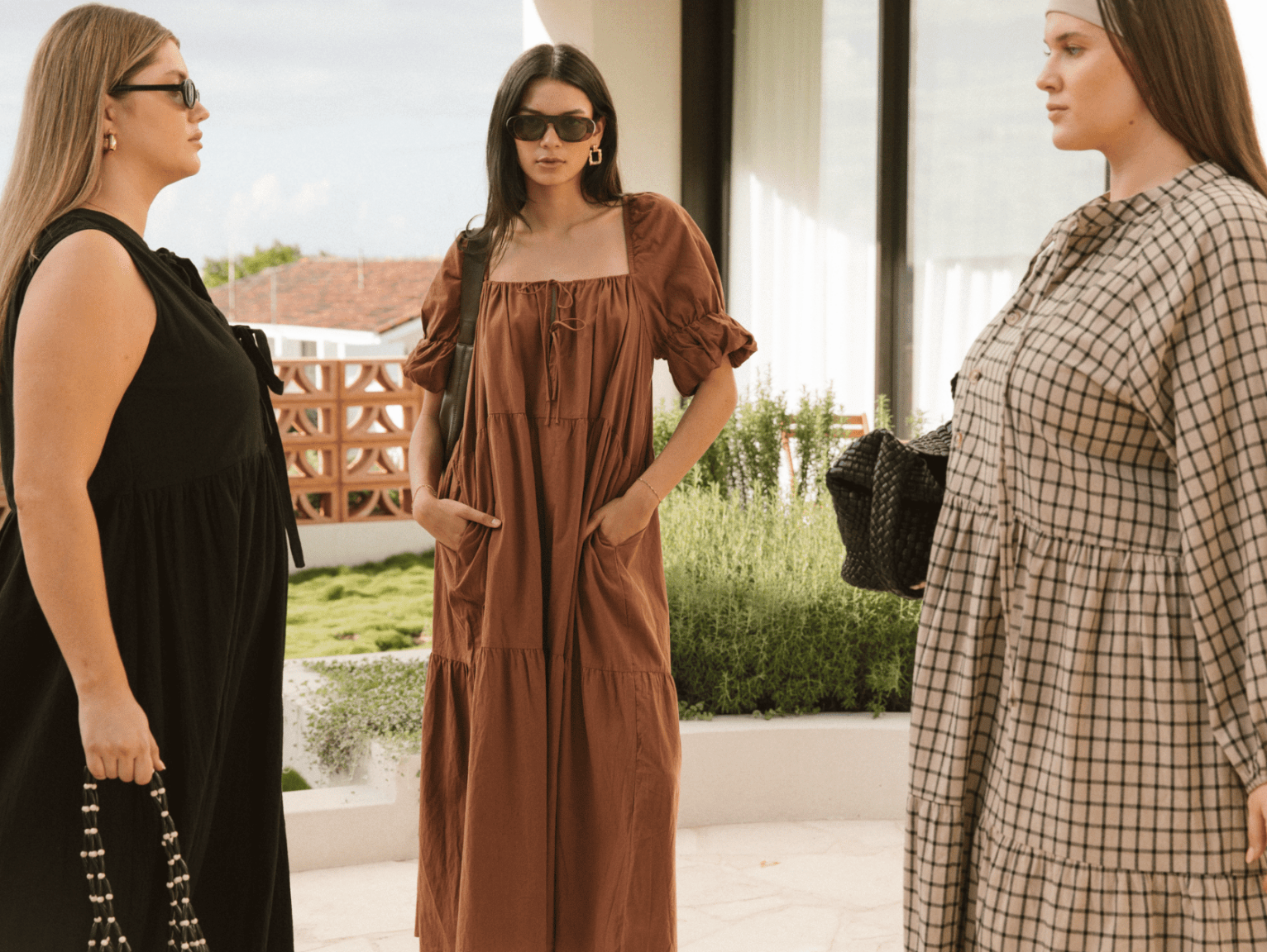 Models wearing The Lullaby Club Essentials Sets and Slouchy Jumpers in cream and cobalt blue. Featuring cozy winter loungewear with breastfeeding-friendly zips and relaxed fits. Designed for modern mums and everyday ease.