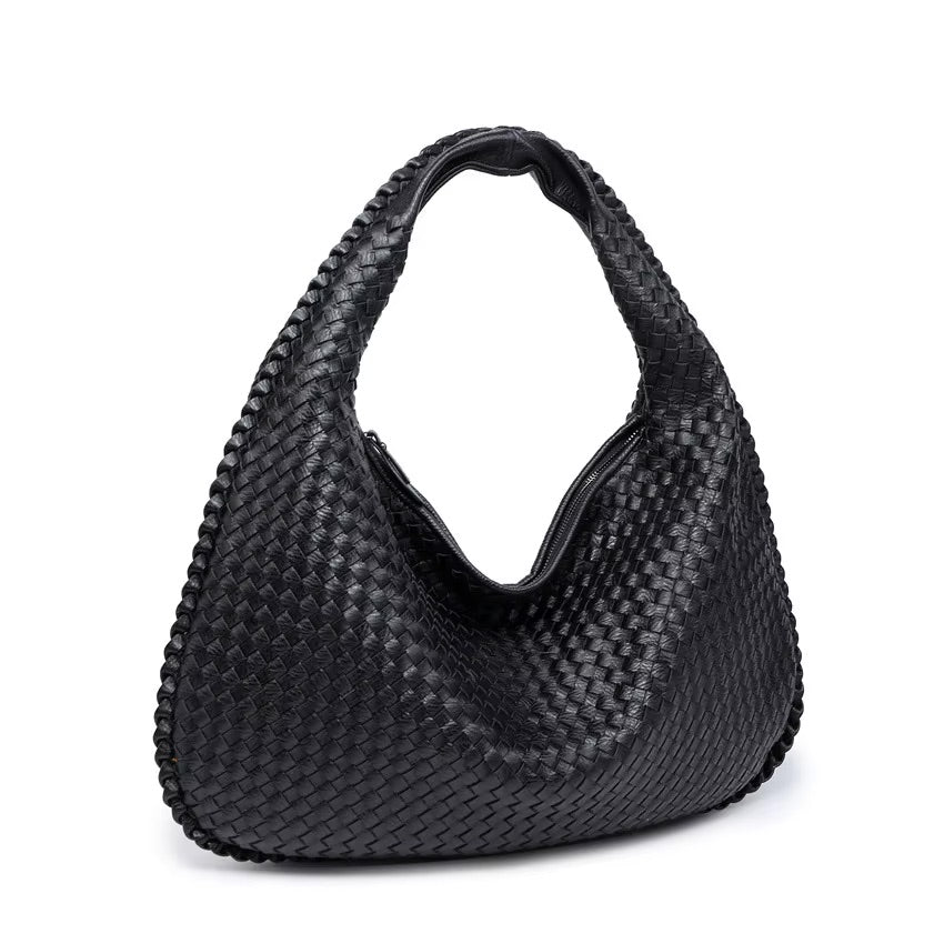 Black woven handbag on a white background