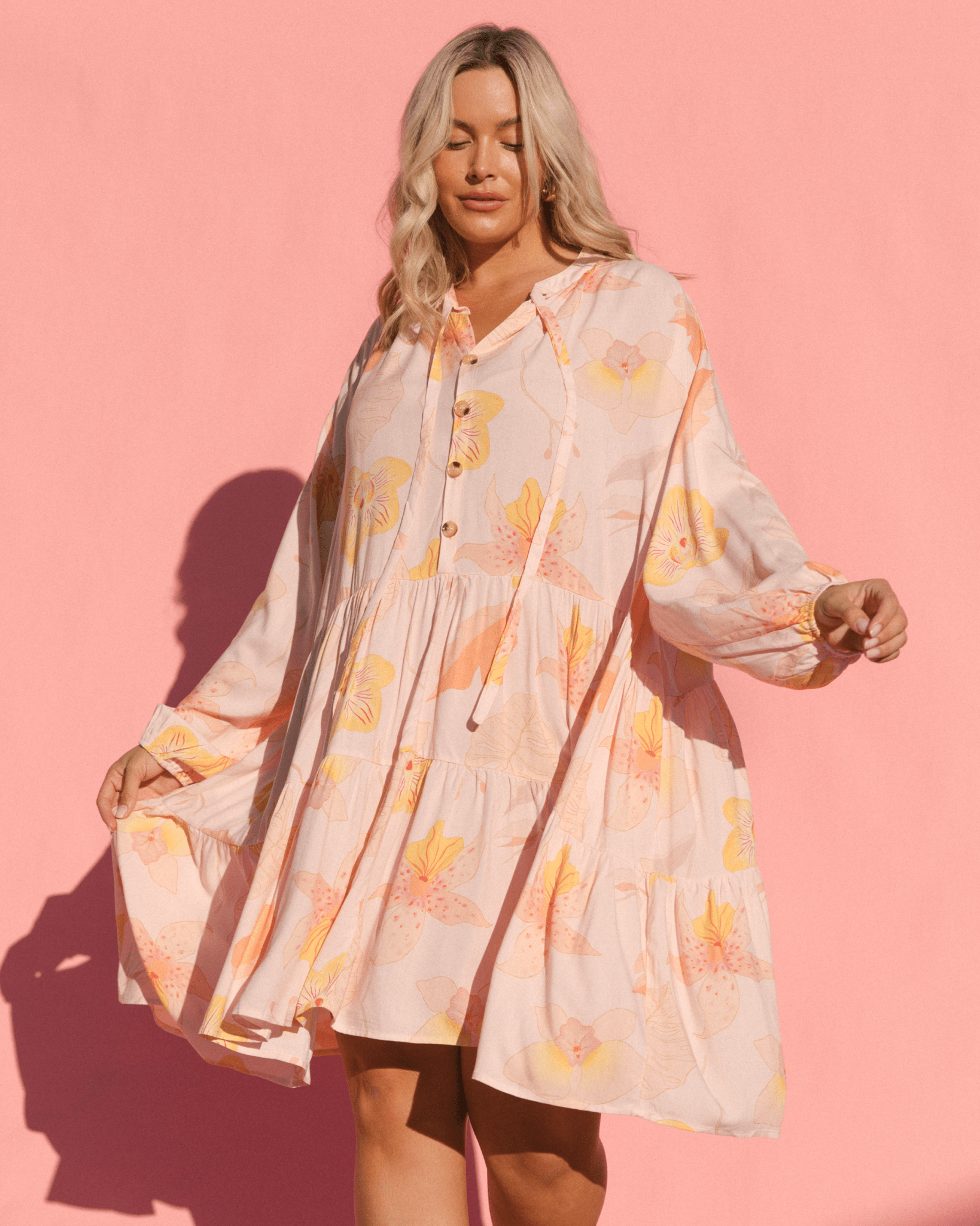 Woman wearing flowy and breathable dress. 