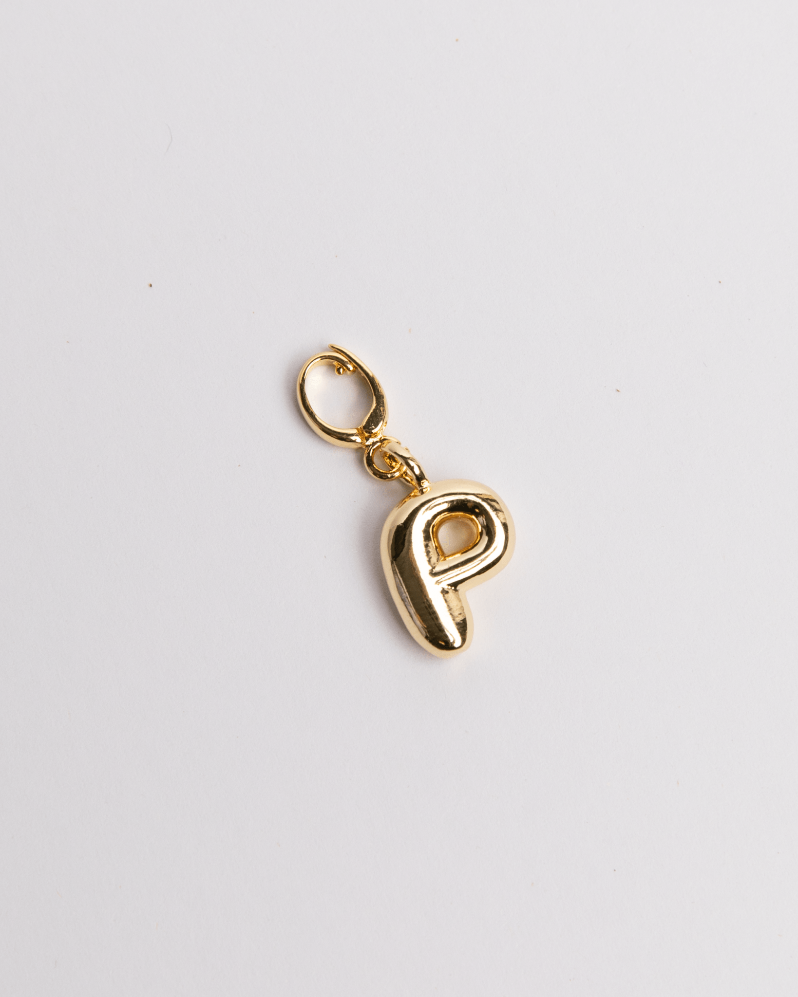 Gold letter 'P' charm in a 3D bubble design