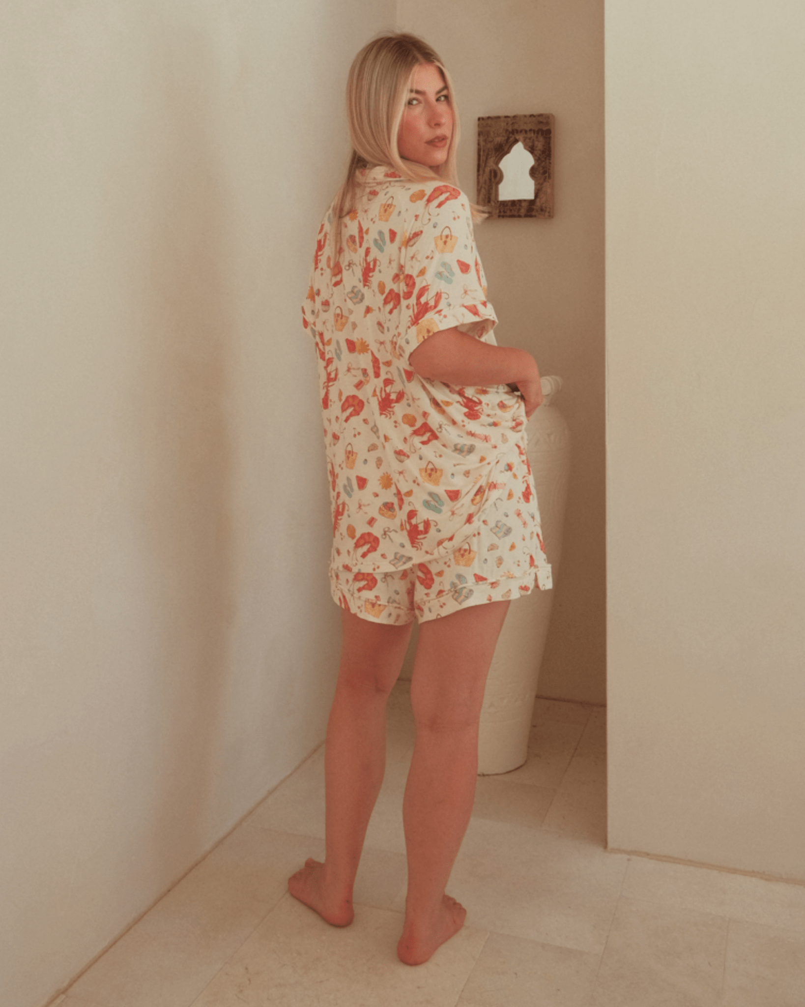 Woman wearing a floral pajama set.