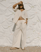 Woman wearing floral pink & cream coloured co-ord.